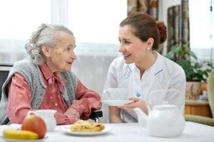 woman eating one of the most healthy meals for the elderly in her home