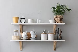 a shelf of items that a senior can reach using a grabber tool